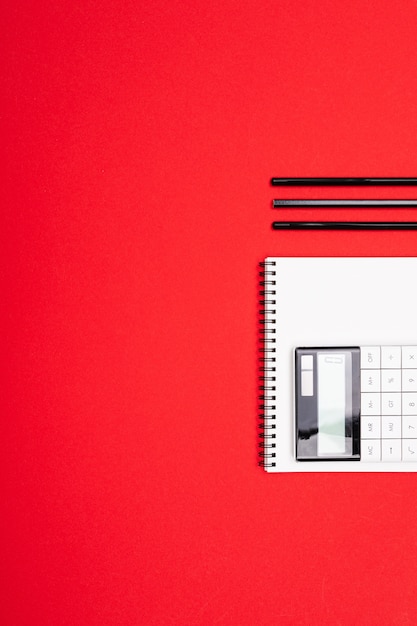 A close-up shot of a calendar with important college application deadlines circled in red. A pen rests on top of the calendar, symbolizing the urgency and planning required.