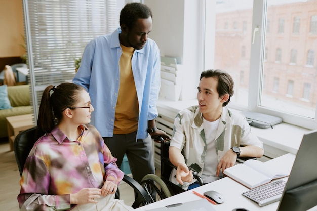 A group of professionals in a modern office setting, mentoring a young college graduate. The atmosphere is supportive and collaborative, emphasizing the value of guidance and shared experience.