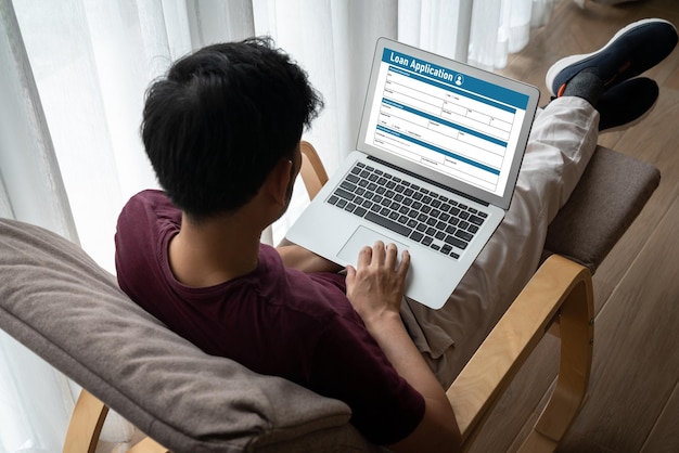 A student working on a laptop with the application requirements for a study abroad program, highlighting the importance of thoroughness and attention to detail in the application process.