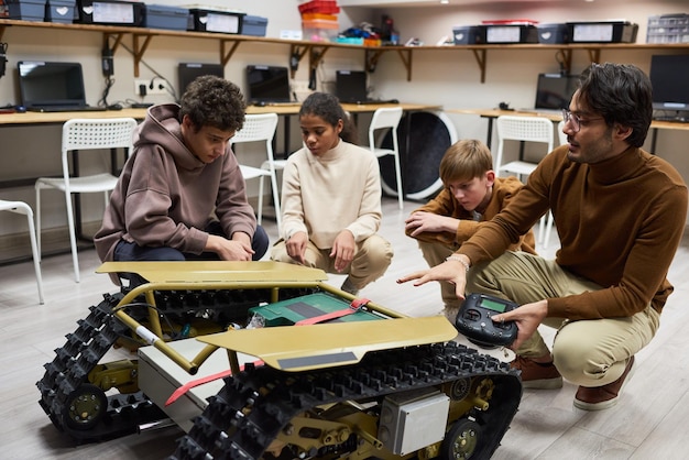 Students participating in an AI and robotics workshop, programming robots for a specific task.