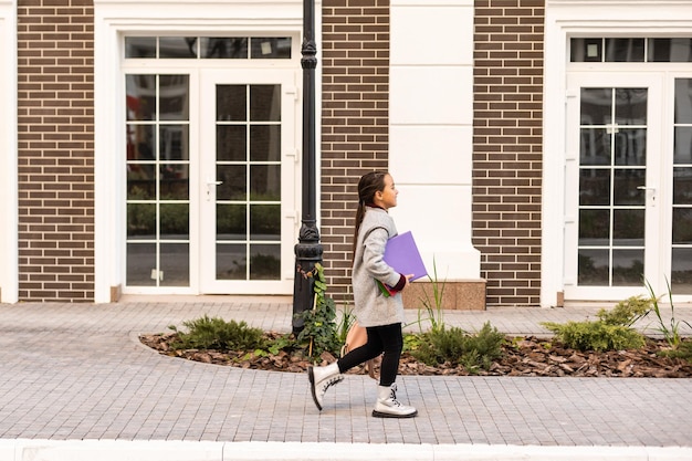 A student walks into a modern and welcoming campus counseling center with a friendly sign outside.
