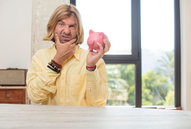 A person happily placing money into a piggy bank with a retirement home in the background, symbolizing consistent savings and retirement planning.