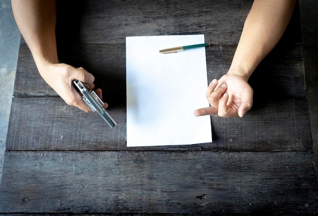 A close-up of a hand pointing at a specific section of an insurance policy document during a review. A pen is resting nearby, implying detailed analysis.