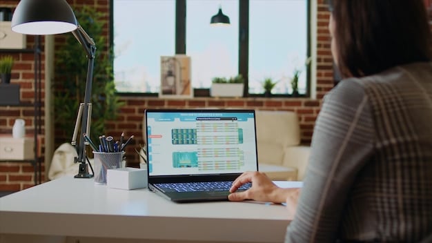 A person sitting at a desk, reviewing financial documents related to REIT investments, with a laptop displaying stock market charts in the background.